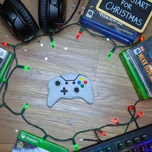 May include: A set of three ceramic mugs with a speckled, matte finish. The mugs are in shades of cream, light gray, and dark gray. Each mug has a simple, modern design and a rounded handle. Perfect for coffee or tea.