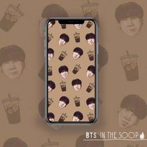 May include: A phone screen displaying a pattern of cartoon faces and iced coffee cups. The background is a light brown colour. The text "BTS in the Soop" is at the bottom of the screen.