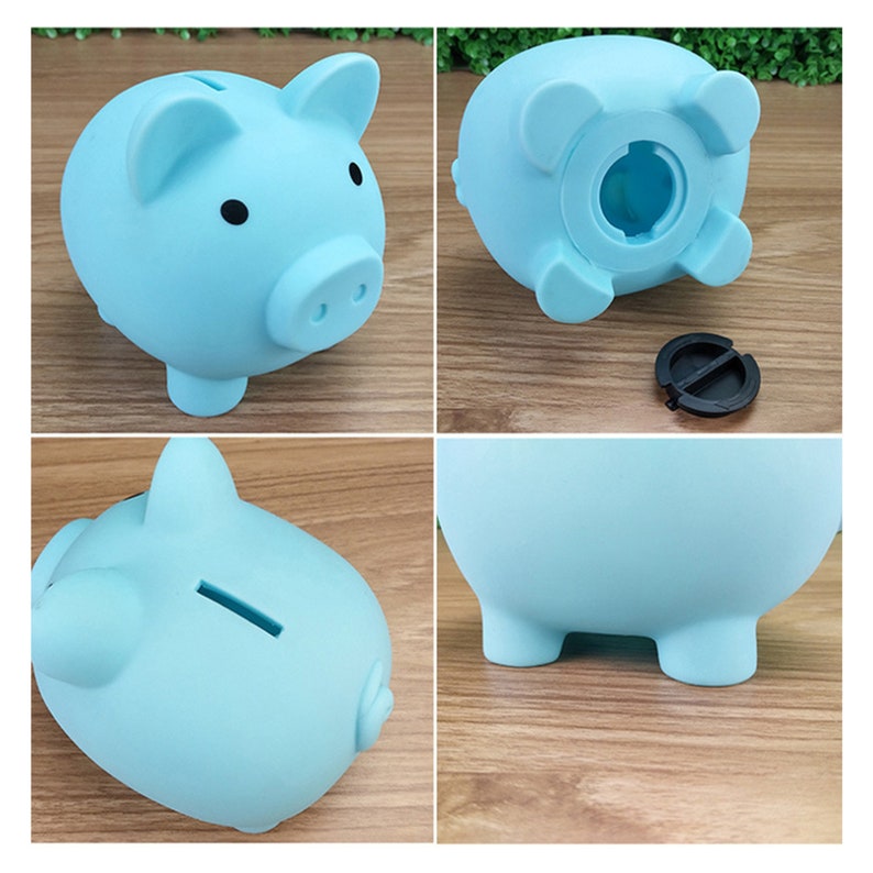 May include: A light blue piggy bank with a slot on the top for coins. The piggy bank has a rounded body and four small feet.