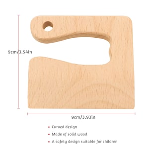 May include: A wooden safety knife holder with a curved design. The holder is 3.54 inches tall and 3.93 inches wide.