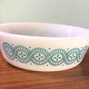 May include: White ceramic baking dish with a teal blue and white geometric pattern around the rim.
