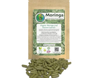 May include: A brown paper bag with a label that reads "Moringa Oleifera Extract Capsules" and "Organic Moringa Leaf Extract Capsules". The bag contains 90 green vegan capsules. The label also includes the daily dose, ingredients, and a QR code.