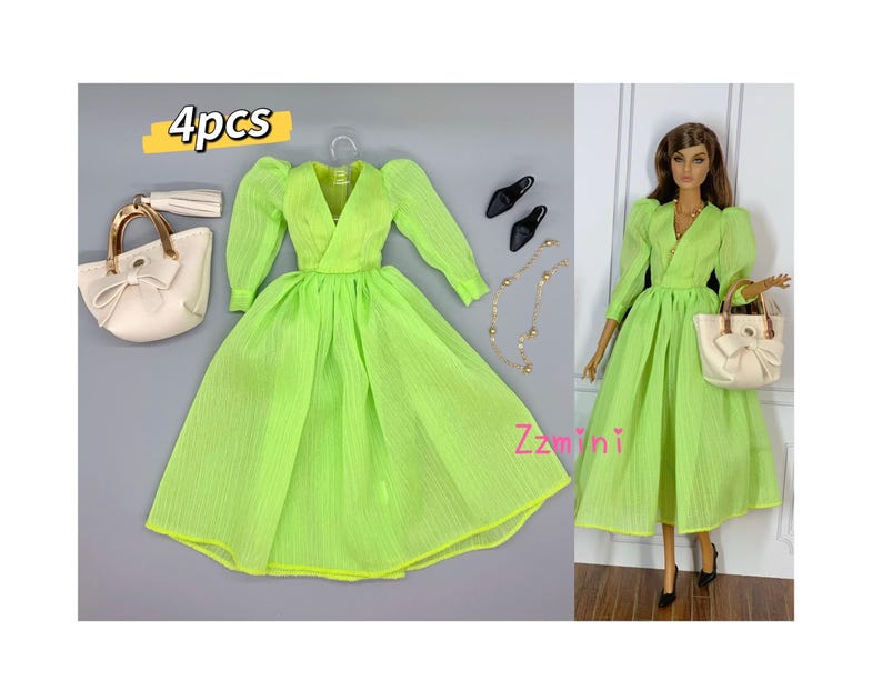 May include: A set of four doll accessories, including a lime green dress with puffed sleeves, a white handbag with a bow, a gold chain necklace, and a pair of black heels. The set is labeled "4pcs".