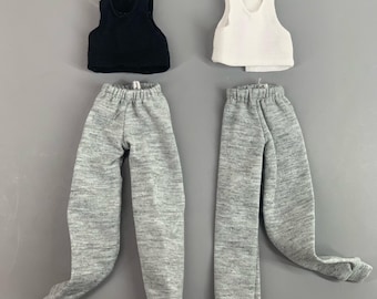 May include: Two sets of doll clothing labeled A and B. Set A includes a black sleeveless crop top and gray sweatpants. Set B includes a white sleeveless crop top and gray sweatpants. The text Zzmini is visible at the bottom center of the image.