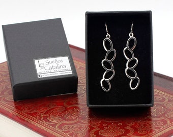 Long and narrow openwork earrings with oval shapes. Handmade sterling silver. Limited edition.