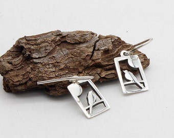 Small earrings with openwork bird