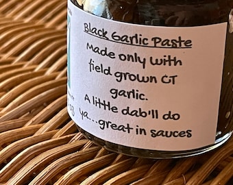 May include: A small glass jar with a white label that reads "Black Garlic Paste Made only with field grown CT garlic. A little dab'll do ya...great in sauces".