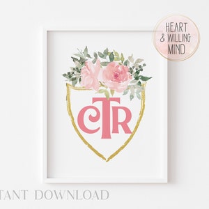 May include: A printable art print featuring a pink and gold shield with the letters "CTR" and a cross inside. The shield is surrounded by pink and green watercolor flowers. The text "HEART & WILLING MIND" is in a circle at the top right of the image.