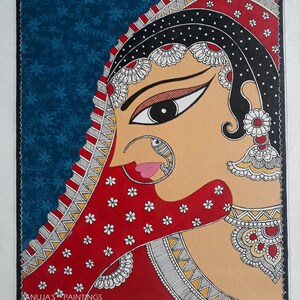 May include: A vibrant painting of a woman's profile, adorned in traditional Indian attire. The artwork features a red veil with white floral accents, a black head covering, and intricate jewelry. The background is a deep blue with a floral pattern. The artist's signature is in the bottom left corner.