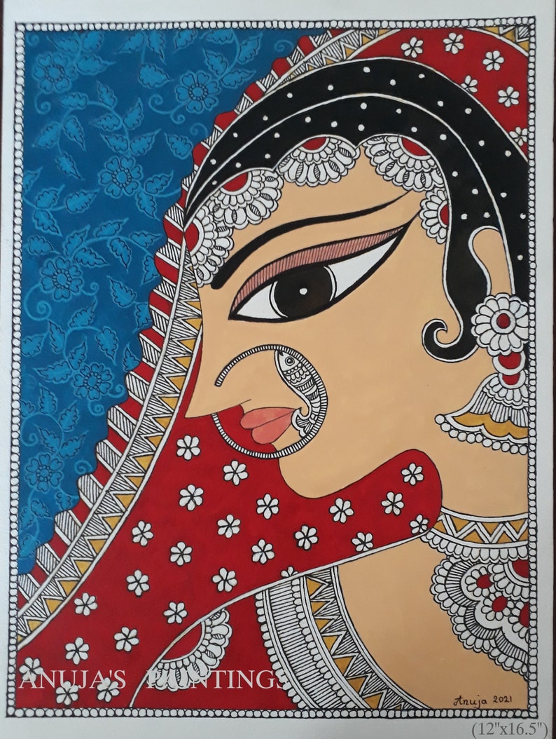 May include: An Indian-style painting of a woman in profile, wearing a red veil with white floral accents. The artwork features intricate details, including a nose ring and ornate jewelry. The background is blue with a floral pattern. The text "Anuja's Paintings" is visible.