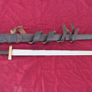 The Medieval age Sword With Leather Scabbard.