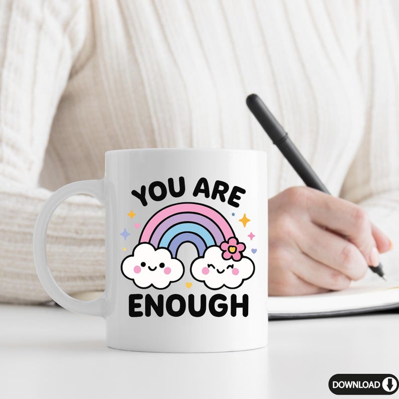 May include: White ceramic mug with a rainbow, clouds, and the text "You are enough".