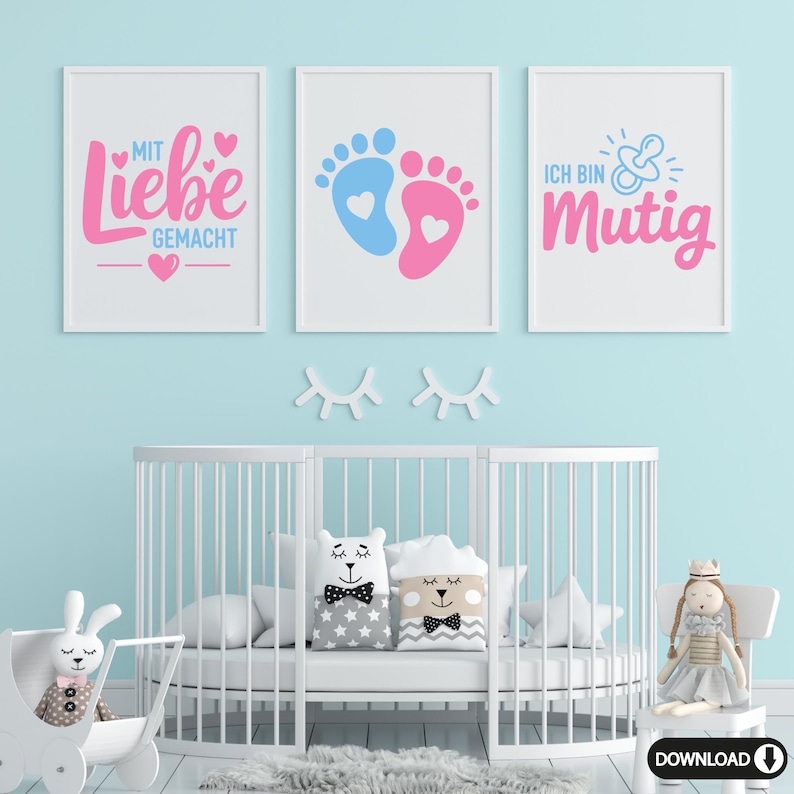 May include: Three framed prints with baby-themed designs. The prints feature pink and blue text and graphics on a white background. The text includes phrases like "Made with Love" and "I am brave". A white crib and decorative items are in the foreground.