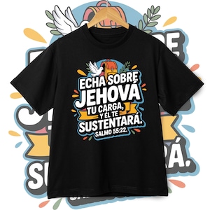 May include: Black t-shirt with the text "Echa sobre Jehov&aacute; tu carga, y &eacute;l te sustentar&aacute;. Salmo 55:22." in white, yellow, and blue. The design includes a dove, a backpack, and floral elements. The shirt is hanging on a wooden hanger.