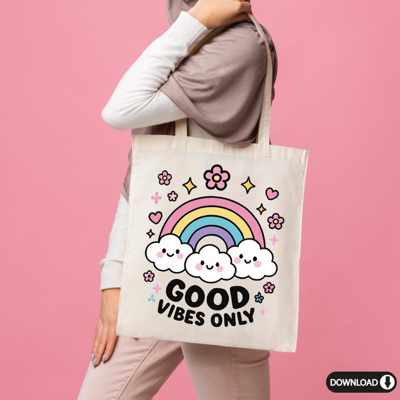 May include: A white tote bag with a rainbow, clouds, and flowers printed on it. The text "GOOD VIBES ONLY" is printed in black below the rainbow.