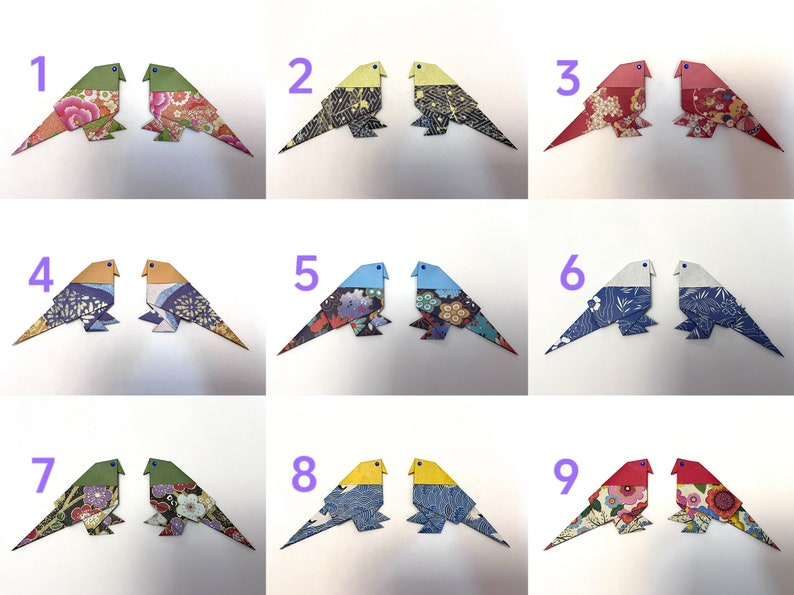 May include: Nine pairs of origami birds, each pair is a different color and pattern. The birds are numbered 1 through 9.