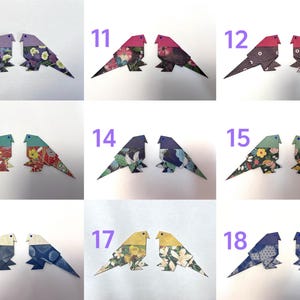 May include: A set of 18 origami birds, each with a unique patterned design. The birds are numbered 10 through 18.