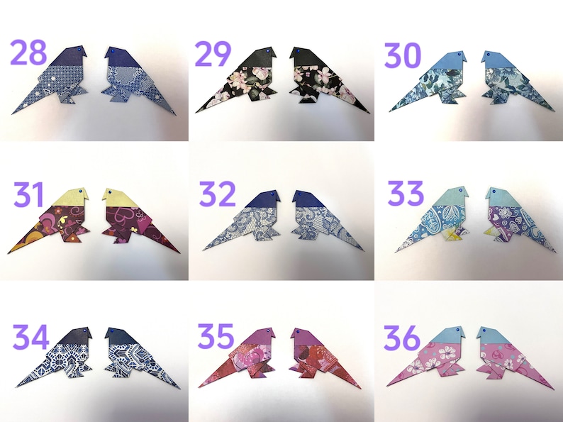 May include: A set of 9 pairs of origami birds, each pair is numbered 28-36. The birds are made from patterned paper and have blue, pink, purple, and yellow accents.
