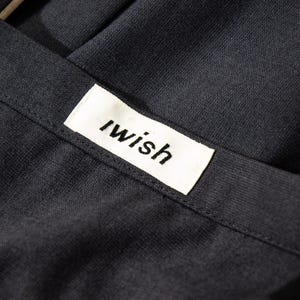 May include: A set of three ceramic mugs with a speckled, cream-colored glaze. Each mug features a different hand-painted floral design in shades of blue, green, and yellow. The mugs have a simple, modern shape.