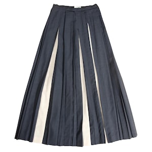 May include: A set of three ceramic mugs with a speckled, matte finish. The mugs are in shades of cream, light gray, and dark gray. Each mug has a simple, minimalist design, perfect for coffee or tea.