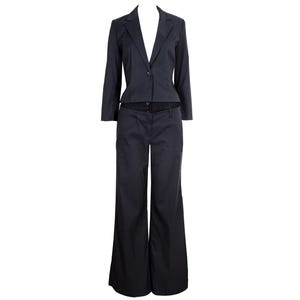 May include: A dark navy blue two-piece suit consisting of a cropped blazer with a single button closure and long sleeves, paired with matching wide-leg trousers. The fabric features a subtle pinstripe pattern throughout the entire garment set.
