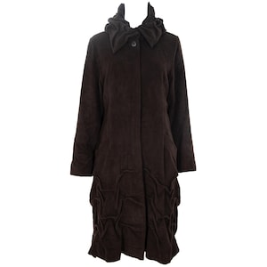 May include: A dark brown corduroy coat with a hood and button closure. The long coat features pockets and a unique gathered design at the hem. A stylish outerwear garment.