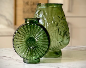 Decorative Green Glass Vases in Various Floral Styles and Sizes.