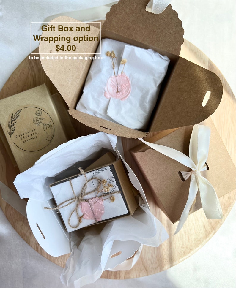 May include: A brown gift box with a white ribbon and a pink wax seal. The box is open and there is tissue paper inside. The text "Gift Box and Wrapping option $4.00 to be included in the packaging box" is visible on the box.