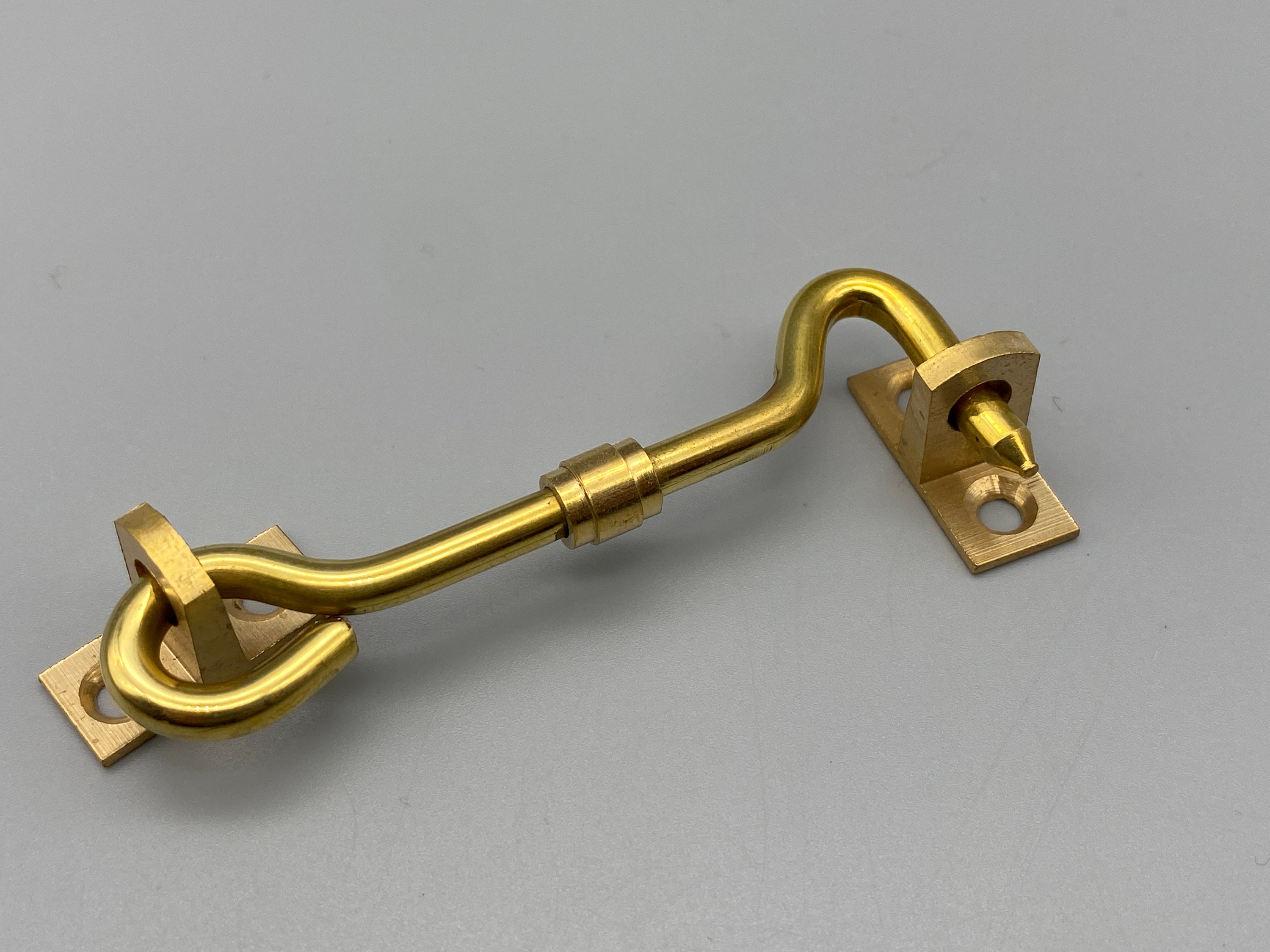 Brass door hook and eye sales