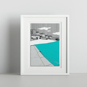 May include: A black and white illustration of a town by the sea. The town is on a hill and the sea is a bright turquoise colour. The illustration is framed in a white frame.