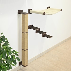May include: A wall-mounted cat tree with a sisal scratching post, three dark brown steps, and a beige hammock. The cat furniture is attached to a white wall with dark brown brackets.