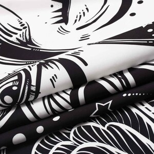 May include: Black and white tapestry with a swirling, abstract design. The design features a large eye with a star and other geometric shapes.
