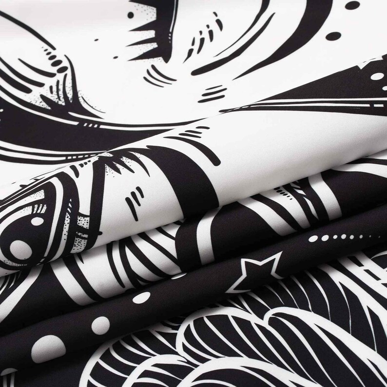 May include: Black and white tapestry with a swirling, abstract design. The design features a large eye with a star and other geometric shapes.