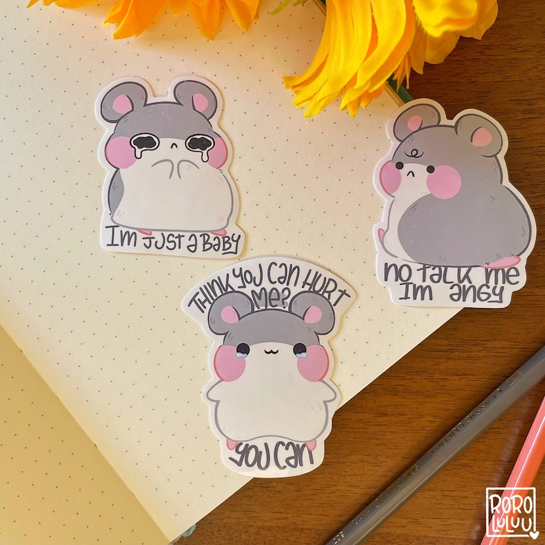 May include: Three cute hamster stickers with different expressions and text. The first sticker shows a hamster with tears in its eyes and the text "I'm just a baby". The second sticker shows a hamster with a sad expression and the text "Think you can hurt me? You can". The third sticker shows a hamster with an angry expression and the text "No talk me I'm angy".