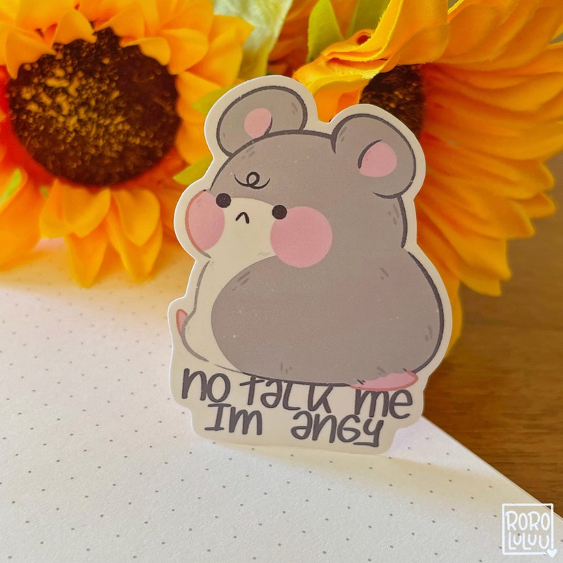 May include: A gray cartoon hamster with pink cheeks and a sad expression. The hamster is sitting on its hind legs with its front paws tucked in. The text "no talk me I'm angry" is written below the hamster.