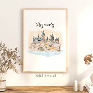 May include: Watercolour print of Hogwarts castle on a rocky island, with the word "Hogwarts" in script. The artwork features a light brown frame and a light blue water base. The words "Digital Download" are at the bottom.
