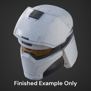 May include: White futuristic helmet with a black visor and a yellow tinted lens. The helmet has a textured surface and a black panel on the top.
