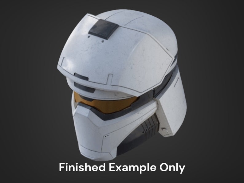 May include: White futuristic helmet with a black visor and a yellow tinted lens. The helmet has a textured surface and a black panel on the top.