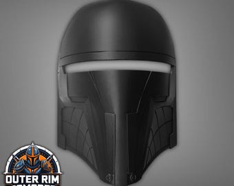 May include: Black 3D-printed helmet with a white visor and detailed paneling. The helmet is a DIY project, as indicated by the text "This is a DIY 3D Print (Do It Yourself)". The Outer Rim Armorer logo is visible in the lower left corner.