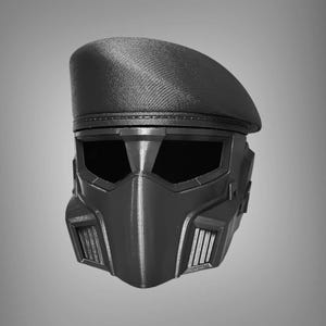 May include: A black, futuristic-style helmet with a beret-like top. The helmet features angular design elements, including a visor and a mouth guard with ventilation slits. The overall aesthetic is sleek and modern, suitable for cosplay or themed events.