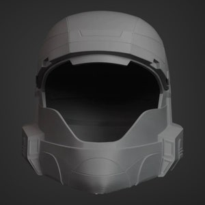 Puede incluir: Un casco de pl&aacute;stico blanco con una visera y un interior gris oscuro. El casco tiene una superficie texturizada y un dise&ntilde;o que se asemeja a un casco de soldado futurista.