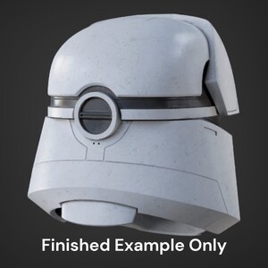 May include: A white helmet with a black visor and a circular opening on the front. The helmet has a textured surface and appears to be made of plastic.