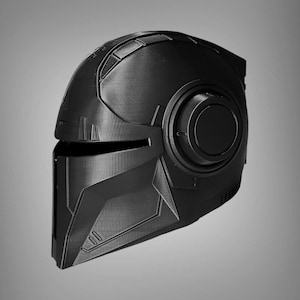 May include: A black helmet with a futuristic design. The helmet has a visor and a large, round, black detail on the side.