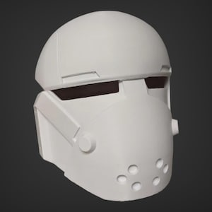 May include: White plastic helmet with a visor and a series of small holes on the lower face.