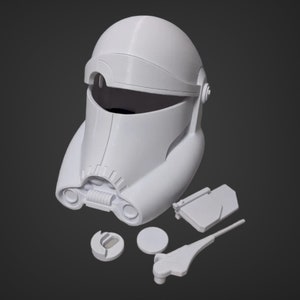 May include: A white, 3D-printed helmet with detached components. The helmet has a rounded top, a visor opening, and detailed facial features. Additional parts include a rectangular piece, two circular pieces, and a long, thin piece.