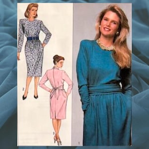 May include: A sewing pattern for two dresses. The first dress is a patterned, knee-length dress with a belt. The second dress is a solid blue, knee-length dress with a sash.