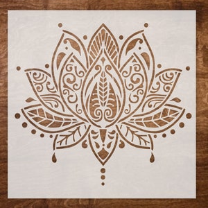 May include: A white stencil of a detailed lotus flower with intricate patterns and swirls. The stencil is ideal for creating decorative designs on walls, furniture, or crafts.