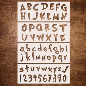 May include: White stencil featuring the alphabet in uppercase and lowercase letters, alongside numbers 1 through 9 and 0. The letters and numbers are presented in a playful, cartoon-like font.