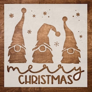 May include: White stencil with three gnomes and the text "merry christmas" in a whimsical font. The gnomes are wearing tall hats and have beards.