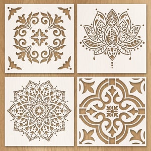 Peut inclure: Quatre motifs de découpe laser décoratifs différents. Les motifs sont un mandala, une fleur de lotus, un motif géométrique et un motif floral. Les motifs sont tous blancs et sur un fond brun clair.